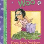 A young girl wearing a flowered tank top and green eye glasses stands next to her piggy bank, which rests on a pile of bills.